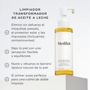 La botella de Medik8 Lipid-Balance Cleansing Oil se encuentra sobre un bloque blanco. El texto enumera beneficios como eliminar maquillaje intenso, apoyar la barrera lipídica y actuar como un limpiador transformador de aceite a leche.